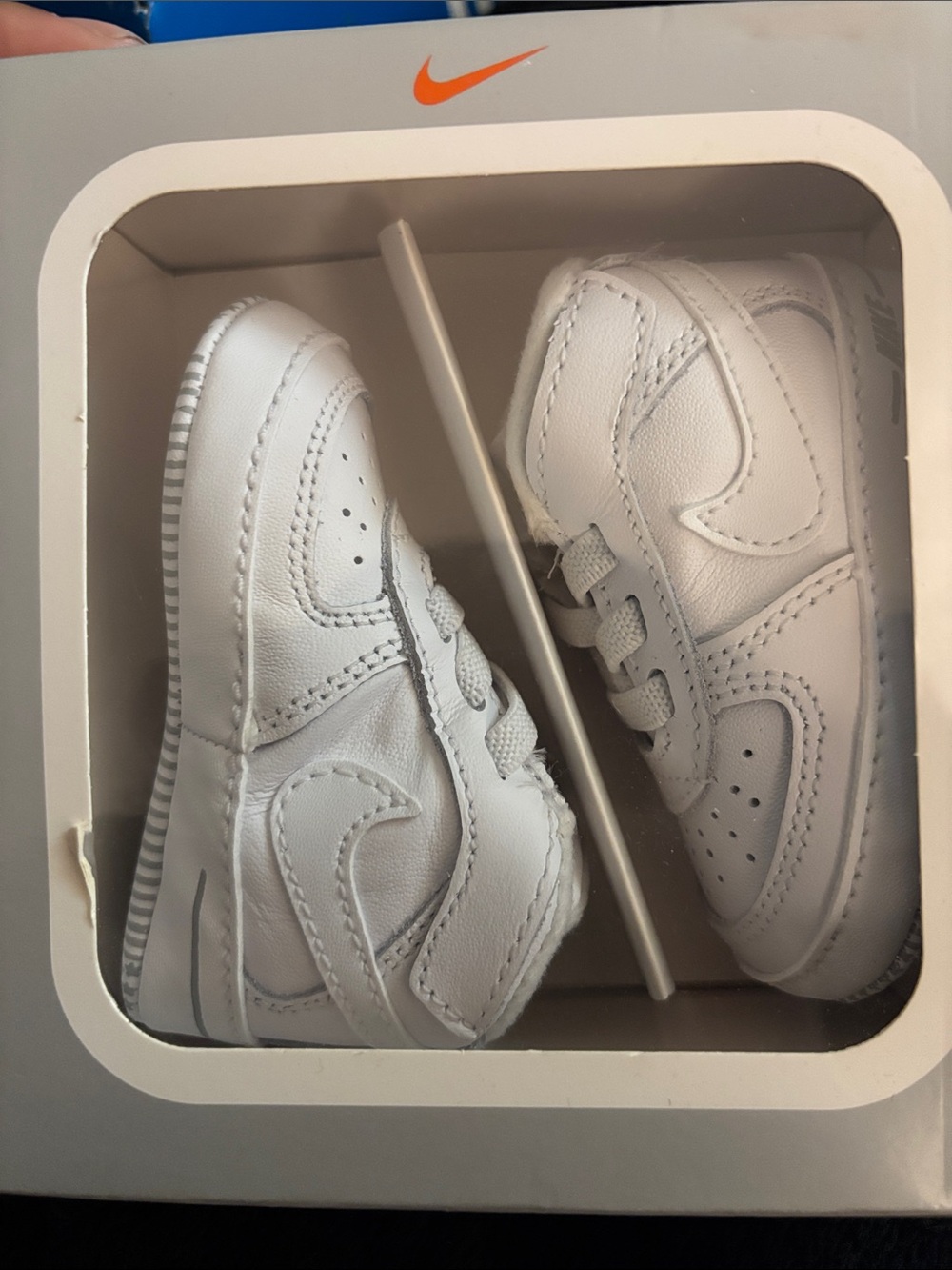 Nike Baby White Leather Mini Sneakers with Orange Swoosh Accent